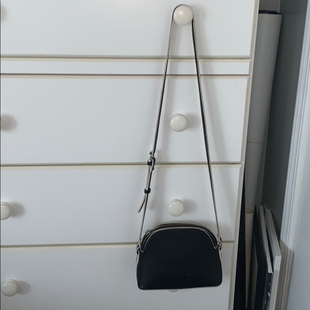 black and white purse with leopard print inside